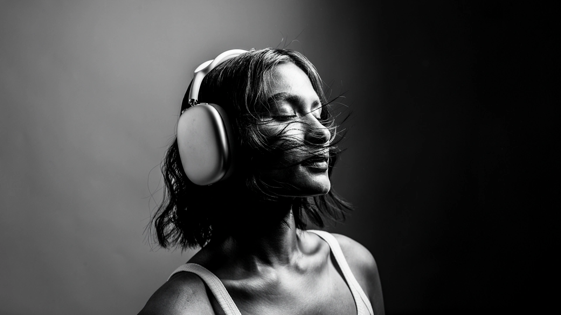 Viewer wearing headphones using a streaming entertainment platform built by AppMatic Tech