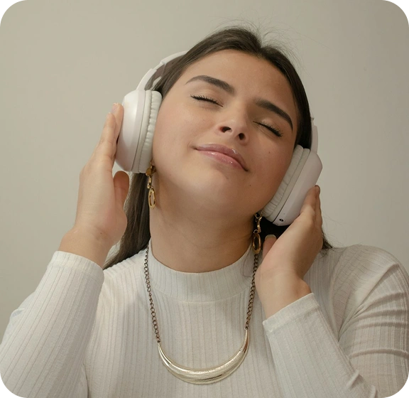 Listener using a connected audio experience of the kind AppMatic Tech engineers for entertainment and infotainment platforms