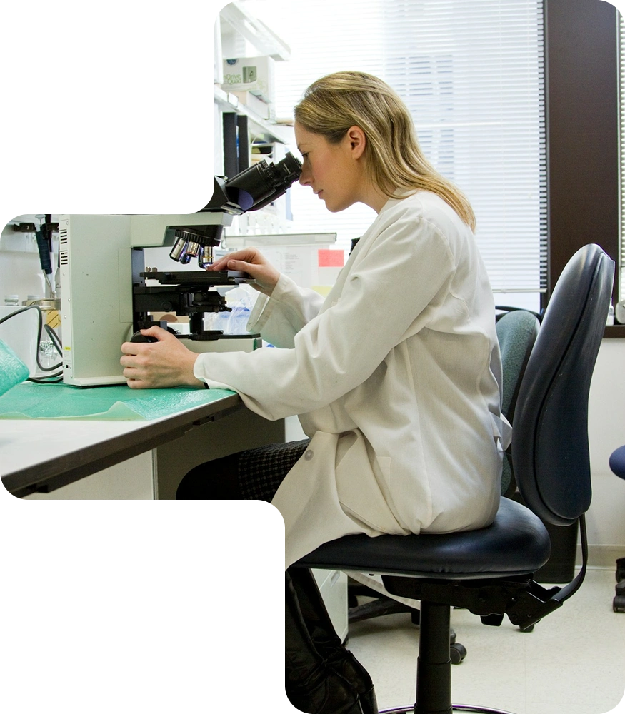 Clinical lab technician using diagnostic equipment connected to AppMatic Tech software