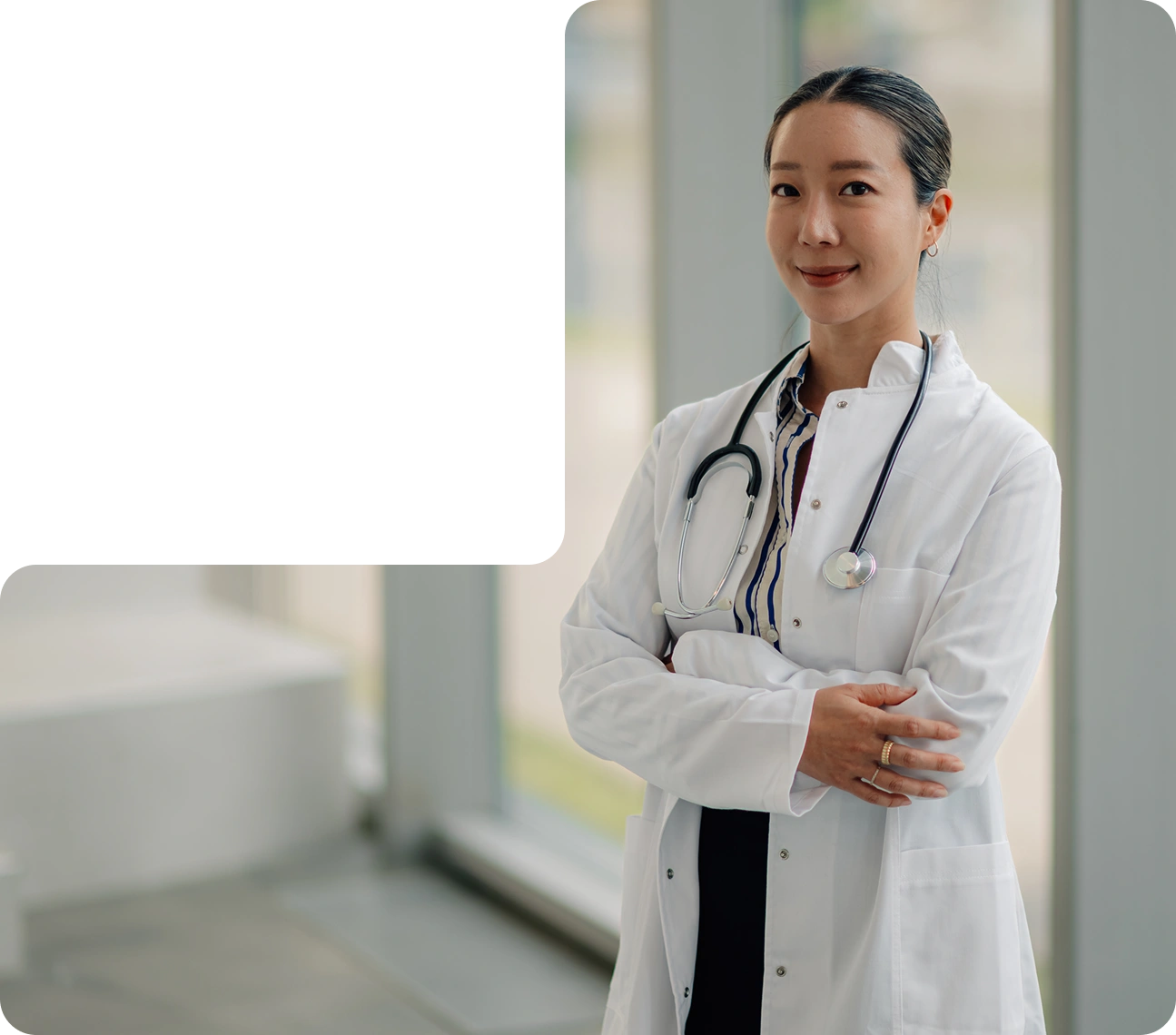 Clinician in a hospital corridor who uses an AppMatic Tech-built healthcare platform