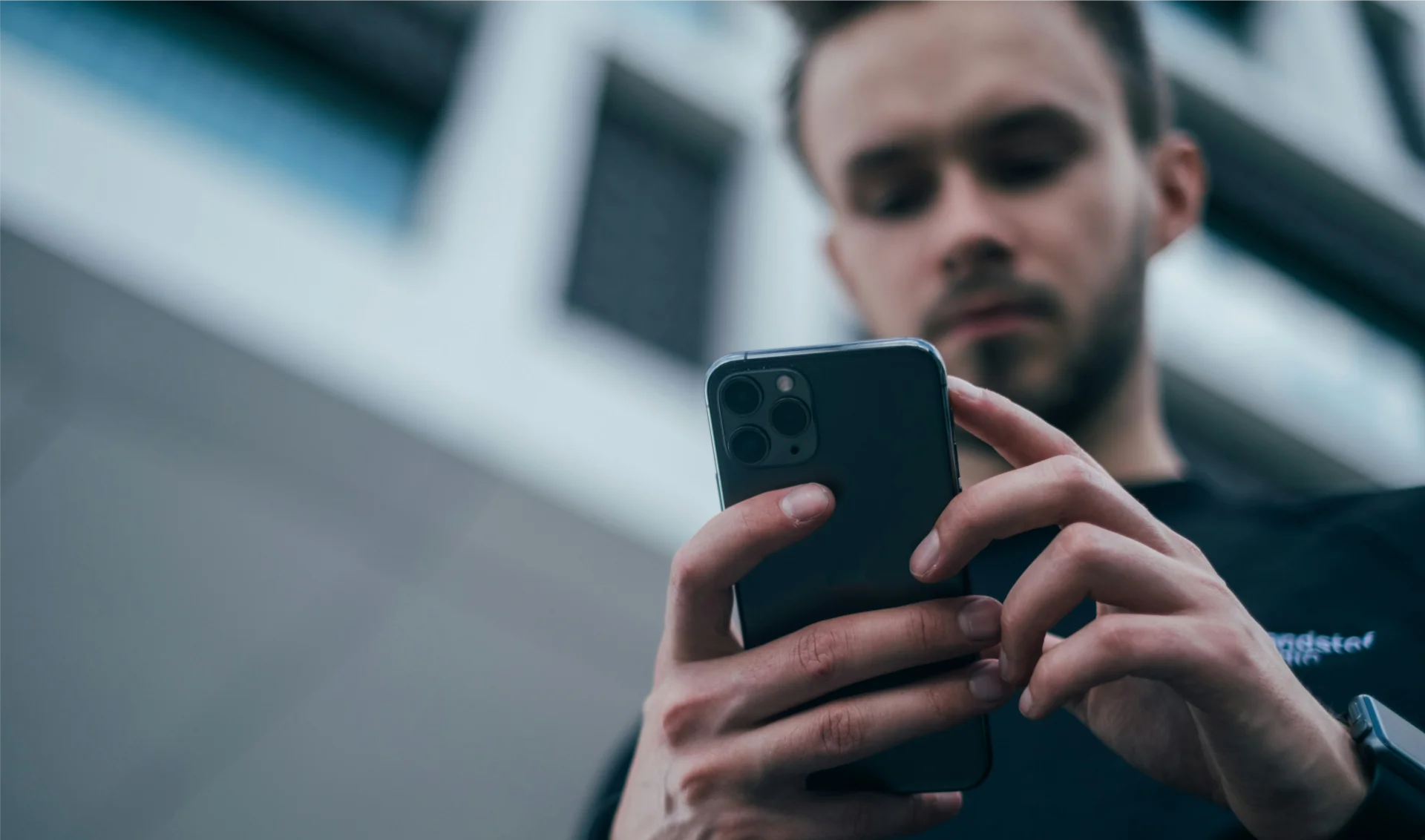 Person using BLE tag tracker app to locate a tagged item