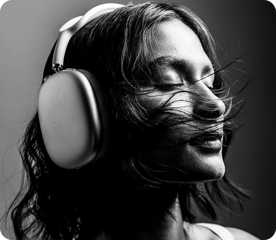 Listener wearing headphones, music platform designed by AppMatic Tech